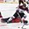 POPRAD, SLOVAKIA - APRIL 14: Switzerland's Nico Gross #26 and Latvia's Deniss Smirnovs #10 collide during preliminary round action at the 2017 IIHF Ice Hockey U18 World Championship. (Photo by Andrea Cardin/HHOF-IIHF Images)

